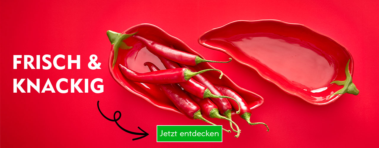 Zwei Keramik-Schalen in Form roter Chilis verlinkt auf Gemüsedeko