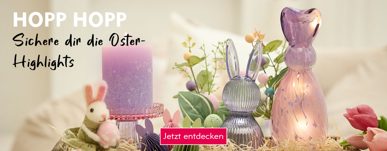 Eine &ouml;sterliche Deko mit lilafarbenen Osterhasen verlinkt auf die Kategorie Osterdeko