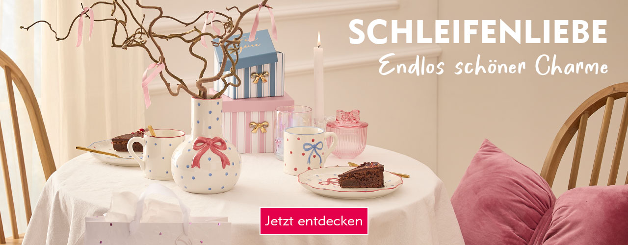 Entdecke Schleifenliebe bei Nanu-Nana Ein gedeckter Tisch mit Schleifen-Produkten verlinkt auf die Kategorie Schleifen