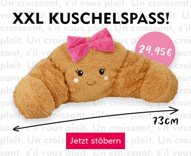 Entdecke das XXL Croissant-Kissen bei Nanu-Nana Schriftzug "XXL Kuschelspaß!" mit Croissant-Kissen verlinkt auf das Kissen Croissant mit Schleife