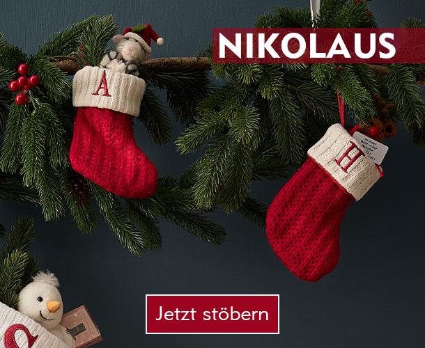 Rot-weiße Nikolaussocken am Tannengrün hängend verlinkt auf Nikolaus