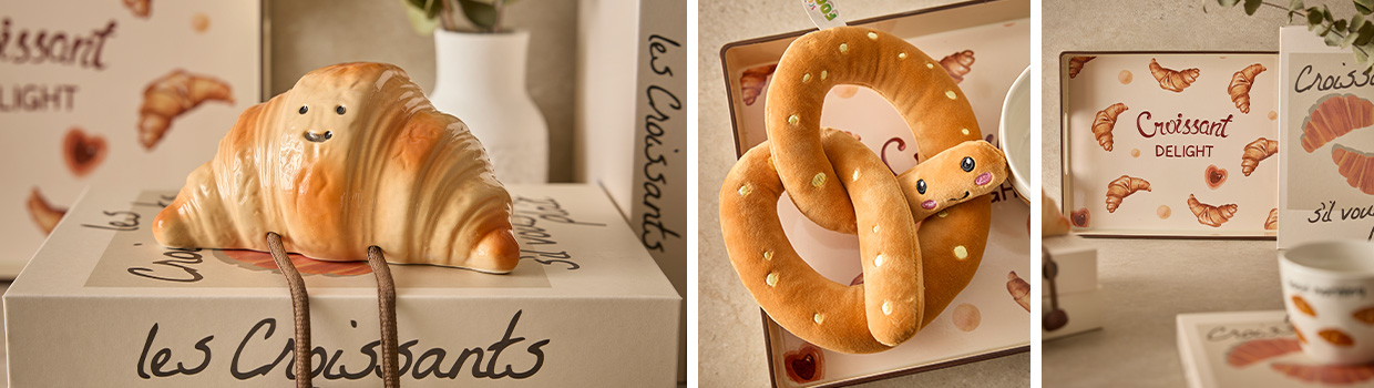 Croissant-Sparddose, Brezel-Kuscheltier und Croissant-Tablett werden pr&auml;sentiert 