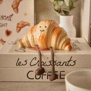 Spardose in Form eines Croissants verlinkt auf Fr&uuml;hst&uuml;ck